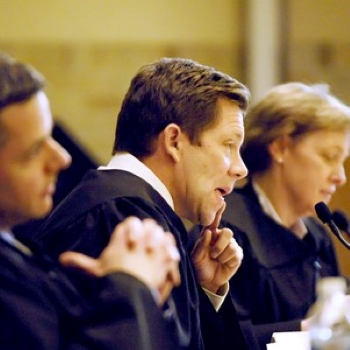 Image of Judge Jeffrey Sutton on the bench with other judges.